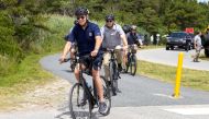 US President Joe Biden takes a bike ride at Gordons Pond in Rehoboth Delaware, US, July 10, 2022. (REUTERS/Tasos Katopodis)