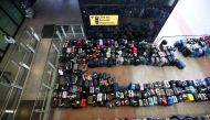Lines of passenger luggage lie arranged outside Terminal 2 at Heathrow Airport in London, Britain, June 19, 2022. REUTERS/Henry Nicholls/File Photo


