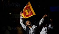People celebrate the resignation of Sri lanka’s President Gotabaya Rajapaksa at a protest site, amid the country’s economic crisis, in Colombo, Sri Lanka, July 14, 2022. (REUTERS/Adnan Abidi)

