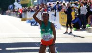 Ethiopia's Gotytom Gebreslase celebrates after winning the women's marathon at the World Athletics Championships in Eugene, Oregon, US, July 18, 2022. (REUTERS/Mike Segar)