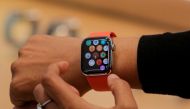 An Apple Store employee shows the Series 5 Apple Watch during the preview of the redesigned and reimagined Apple Fifth Avenue store in New York, U.S., September 19, 2019. REUTERS/Brendan McDermid/File Photo