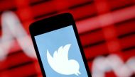 The Twitter logo is shown on a smartphone in front of a displayed stock graph in this April 29, 2015 photo illustration. (REUTERS/Dado Ruvic)