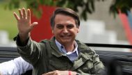 Jair Bolsonaro, far-right lawmaker and presidential candidate of the Social Liberal Party (PSL), gestures at a polling station in Rio de Janeiro, Brazil October 28, 2018. REUTERS/Pilar Olivares