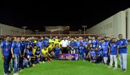 Football players with the officials.