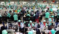 Employees work at at a garments factory in Gazipur, Bangladesh, February 7, 2021. Picture taken February 7, 2021. REUTERS/Mohammad Ponir Hossain/File Photo
