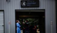 Staff members of the Westchester Medical Center await the arrival of people to be vaccinated with monkeypox vaccine in a drive-through point at the Westchester Medical Center in Valhalla, New York, U.S., July 28, 2022. REUTERS/Eduardo Munoz