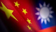 Chinese and Taiwanese printed flags are seen in this illustration taken, April 28, 2022. Picture taken April 28, 2022. REUTERS/Dado Ruvic/Illustration


