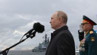 Russia's President Vladimir Putin and Defence Minister Sergei Shoigu take part in a parade marking Navy Day in Saint Petersburg, Russia July 31, 2022. Sputnik/Mikhail Klimentyev/Kremlin via REUTERS ATTENTION EDITORS - THIS IMAGE WAS PROVIDED BY A THIRD PARTY.