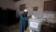 A man casts his ballot during the parliamentary election, in Pikine, on the outskirts of Dakar, Senegal, July 31, 2022. REUTERS/Zohra Bensemra