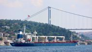 The Sierra Leone-flagged cargo ship Razoni, carrying Ukrainian grain, sails in the Bosphorus en route to Lebanon, in Istanbul, Turkey, August 3, 2022. (REUTERS/Yoruk Isik)