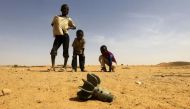File Photo: Children look at the fin of a mortar projectile that was found in North Darfur, Sudan. (Reuters / Mohamed Nureldin Abdallah)