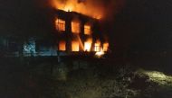 Firefighters extinguish a burning hospital building hit by a Russian missile strike, as Russia's attack on Ukraine continues, in Mykolaiv, Ukraine August 1, 2022. REUTERS/Stanislav Kozliuk/File Photo