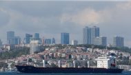 The Sierra Leone-flagged cargo ship Razoni, carrying Ukrainian grain, sails in the Bosphorus en route to Lebanon, in Istanbul, Turkey, August 3, 2022. (REUTERS/Dilara Senkaya)

