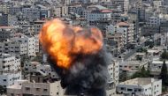 Flame and smoke rise during an Israeli air strike in Gaza City on August 6, 2022. (Reuters/Mohammed Salem)