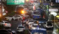 Abandoned vehicles fill the road in flooded area during heavy rain in Seoul, South Korea, August 8, 2022. Yonhap via Reuters