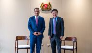 Deputy Prime Minister and Minister of Foreign Affairs H E Sheikh Mohammed bin Abdulrahman Al Thani with Deputy Prime Minister and Minister for Finance of Singapore, H E Lawrence Wong, in Singapore, yesterday.
