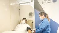 Ahlibank employee donates blood.