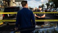 New Jersey Police officers stand guard near the building where alleged attacker of Salman Rushdie, Hadi Matar, lives in Fairview, New Jersey, US, August 12, 2022. (REUTERS/Eduardo Munoz)