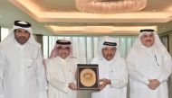 Chairman of Qatar Hotels Association Sheikh Faisal bin Qassim Al Thani with President of the Arab Tourism Organisation Dr. Bandar bin Fahd Al Fahid and other officials during a meeting.
