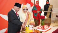 Indonesian Ambassador H E Ridwan Hassan leads the Tumpeng cutting which symbolises the gratitude of Indonesian people for the blessing of independence. 