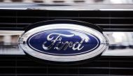 A Ford logo is seen on the grill of a 2015 F-150 truck outside the New York Stock Exchange in the Manhattan borough of New York, January 13, 2014. REUTERS/Lucas Jackson