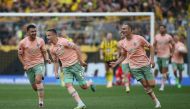 Werder Bremen's Niklas Schmidt celebrates scoring their second goal with Milos Veljkovic and Amos Pieper REUTERS/Thilo Schmuelgen