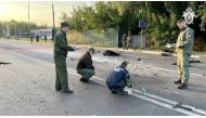 Reuters image of investigators at the site of suspected car bomb attack that killed Darya Dugina