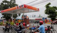People wait outside a petrol station as Haiti's main fuel terminal renewed deliveries that had been suspended due to an outbreak of gang violence, in Port-au-Prince, on July 14, 2022. File Photo / Reuters