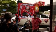 Protesters gather next to a picture of Thailand's Prime Minister Prayuth Chan-ocha outside the Government House, in Bangkok, on August 24, 2022. REUTERS/Athit Perawongmetha