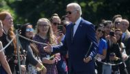 US President Joe Biden greets people on South Lawn after arriving on Marine One from a trip to Delaware at the White House in Washington, on August 24, 2022. REUTERS/Leah Millis