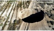 A sinkhole is exposed at a mining zone close to Tierra Amarilla town, in Copiapo, Chile, August 1, 2022. REUTERS/Johan Godoy/File Photo