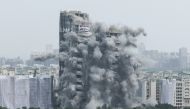 The Supertech Twin Towers collapses following a controlled demolition after the Supreme Court found them in violation of building norms, in Noida, India, August 28, 2022. REUTERS/ Anushree Fadnavis