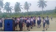 School students and staff gather in an open area after a magnitude 6.4 earthquake struck near Mentawai Islands, in South Nias, North Sumatra, Indonesia August 29, 2022 in this screen grab obtained from a social media video. Facebook/Doniman Aro Harefa/via REUTERS