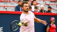 Aug 8, 2022; Montreal, Quebec, Canada; Stan Wawrinka (SUI) hits a shot against Emil Ruusuvuori (FIN) (not pictured) during first round play at IGA Stadium. Mandatory Credit: David Kirouac-USA TODAY Sports

