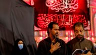 Shi'ite Muslim pilgrims read prayers as they commemorate the Arbaeen, in Kerbala, Iraq September 28, 2021. Reuters/Abdullah Dhiaa Al-Deen/File Photo