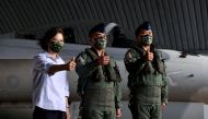 Taiwan President Tsai Ing-wen poses for a photo with pilots at an Air Force base in Penghu Islands, Taiwan, August 30, 2022. (REUTERS/Ann Wang)