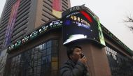 File Photo: A man walks past the main office of Korea Exchange Bank in Seoul, January 27, 2012. (REUTERS/Kim Hong-Ji)