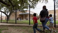 Families arrive at Uvalde Elementary School for a Meet the Teacher event before the start of the new school year following the mass shooting at Robb Elementary in Uvalde, Texas, U.S. August 30, 2022. REUTERS/Nuri Vallbona