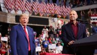 Former U.S. President Donald Trump gestures as Republican Pennsylvania governor candidate Doug Mastriano addresses attendees during a rally in Wilkes-Barre, Pennsylvania, on September 3, 2022.  REUTERS/Andrew Kelly