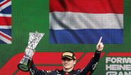 Red Bull's Max Verstappen celebrates on the podium with the trophy after winning the Dutch Grand Prix at the Circuit Zandvoort, in Zandvoort, Netherlands, on September 4, 2022. 
REUTERS/Yves Herman