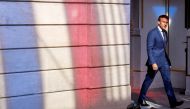 France's President Emmanuel Macron arrives to address the media following a conference with Germany's Chancellor Olaf Scholz on the energy crisis via video link, at the Elysee Palace in Paris, on September 5, 2022.  Ludovic Marin/Pool via REUTERS
