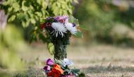 Flowers stand outside a house that was investigated by police as a crime scene, after a stabbing spree killed 10 people on the James Smith Cree Nation and nearby town of Weldon, in Weldon, Saskatchewan, Canada September 5, 2022. Reuters/David Stobbe