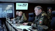 Russian President Vladimir Putin (centre), Defence Minister Sergei Shoigu (left) and Chief of the General Staff of Russian Armed Forces Valery Gerasimov oversee the Vostok-2022 (East-2022) military drills at Sergeyevsky training ground in the far eastern Primorsky Region, Russia, on September 6, 2022.  Sputnik/Mikhail Klimentyev/Pool via REUTERS
