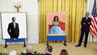 Former US President Barack Obama reacts during the unveiling of his and former first lady Michelle Obama's official White House portraits, painted by Robert McCurdy and Sharon Sprung, respectively, in the East Room of the White House, in Washington, on September, 7, 2022. REUTERS/Evelyn Hockstein