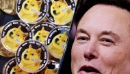 A photo of Elon Musk is displayed on a smartphone placed on representations of cryptocurrency Dogecoin in this illustration taken on June 16, 2022. REUTERS/Dado Ruvic/Illustration/File Photo
