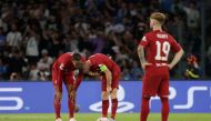 Liverpool's James Milner and Virgil van Dijk react after Napoli's Piotr Zielinski scored their fourth goal REUTERS/Ciro De Luca