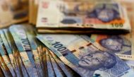 File Photo: South African bank notes featuring an image of former South African President Nelson Mandela are displayed at an office in Johannesburg. (REUTERS/Siphiwe Sibeko)