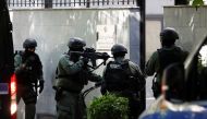 Members of the police special unit enter the Embassy of the Islamic Republic of Iran, as Albania cuts ties with Iran and orders diplomats to leave over cyberattack, in Tirana, Albania, on September 8, 2022. (REUTERS/Florion Goga)