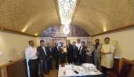 Club President Basheer Ahmed presents a memento to Raghavan Menon in the presence of other members.