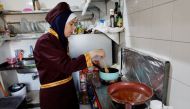 Palestinian chef Amena Al-Hayek cooks a meal at the newly-opened women-only restaurant, called Sabaia VIP, in Gaza City on September 6, 2022. Reuters/Mohammed Salem